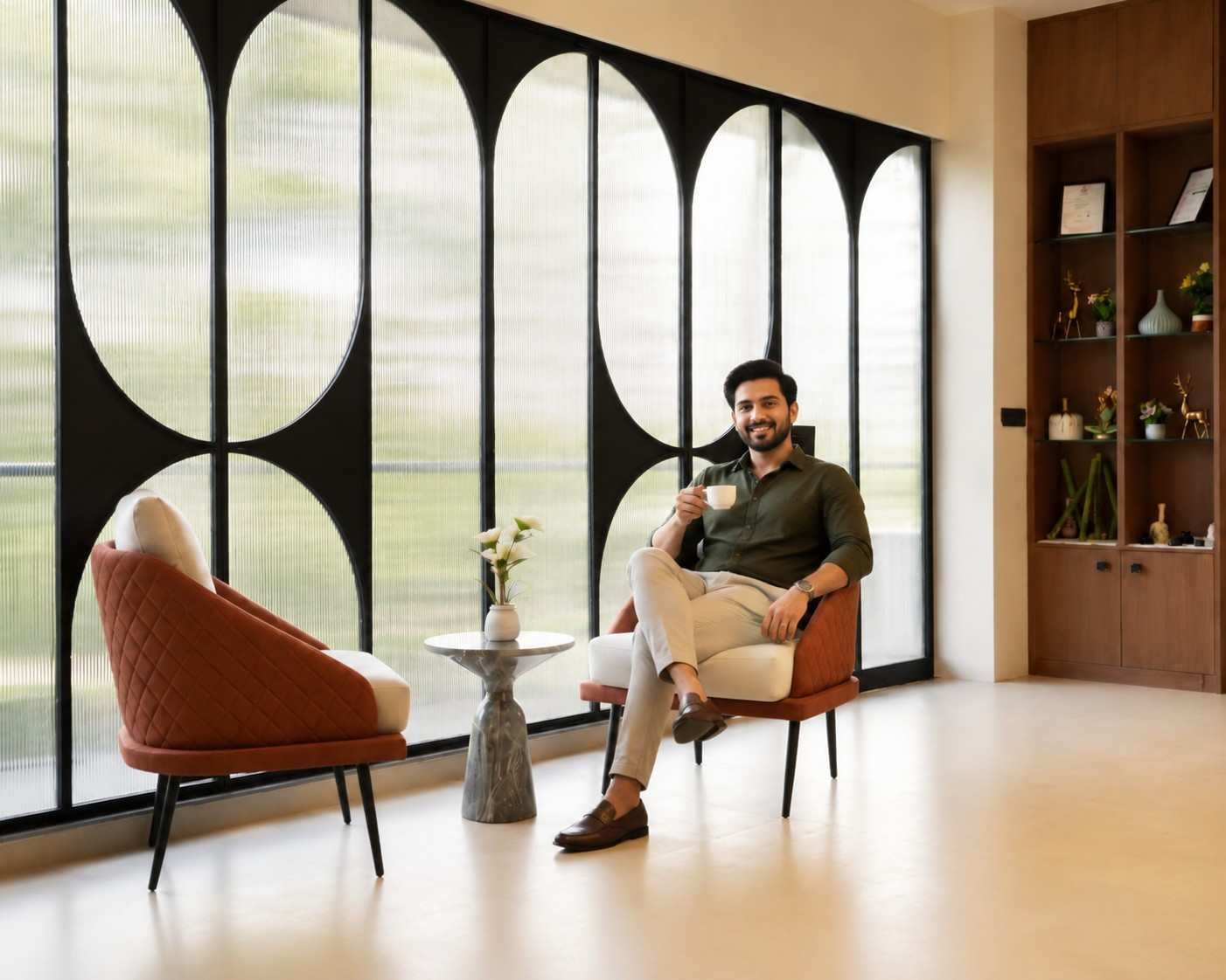 Devang Patel sitting comfortably in quiet contemplation in warm ambient light