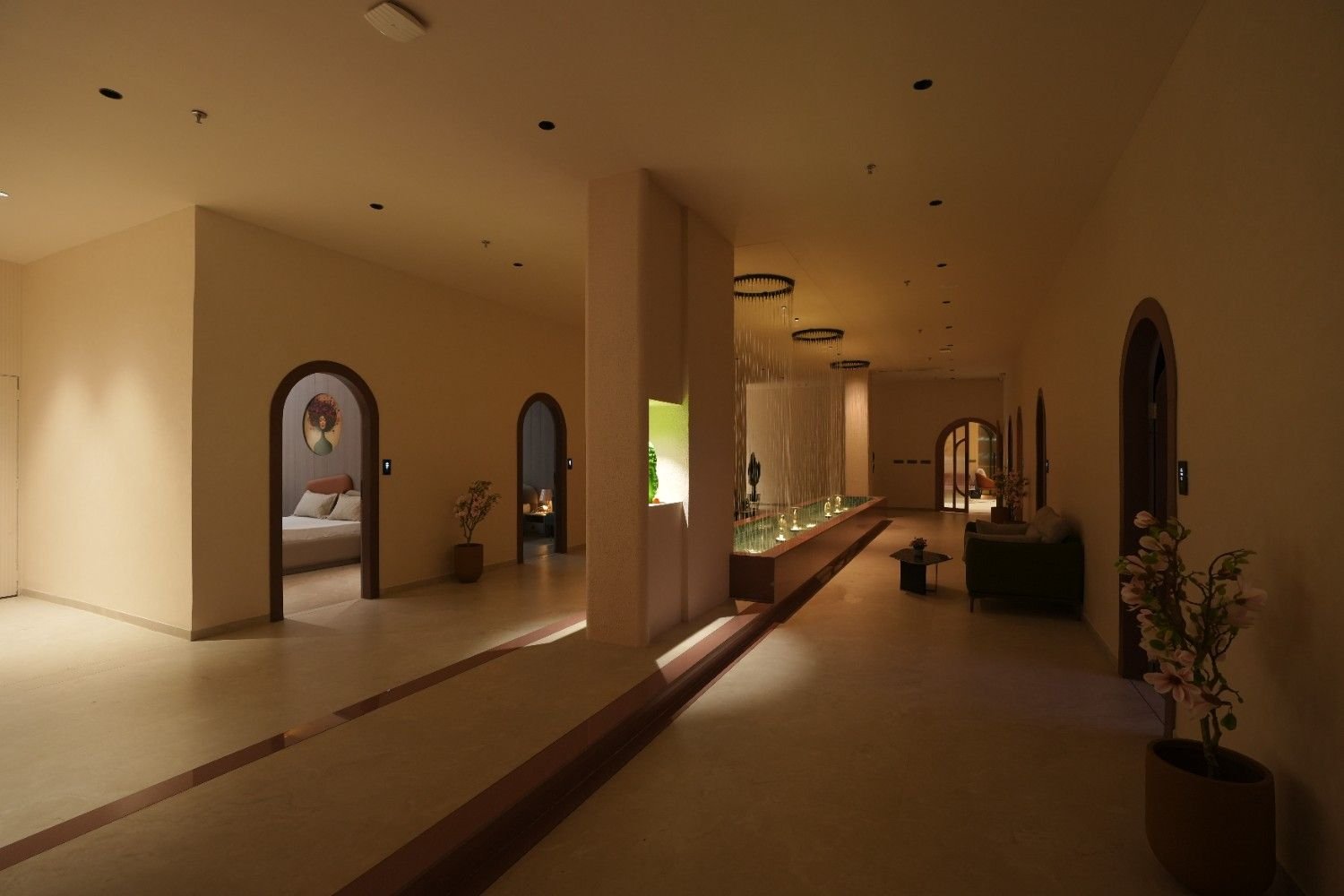 Serene spa hallway with water feature full view at The Bliss